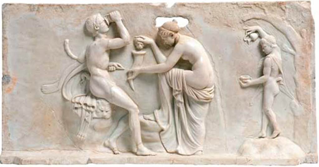 House of Dionysiac Reliefs, Herculaneum. Dionysian marble relief showing two Satyrs and a Nymph, all engaged in the pouring and drinking of wine.
Found in 1997, on south wall. Inventory number.